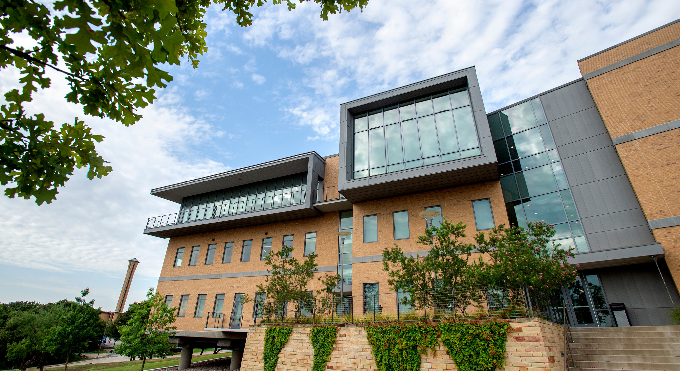 Professor Matthew Berry leads class on the steps of Cardinal Farrell Hall