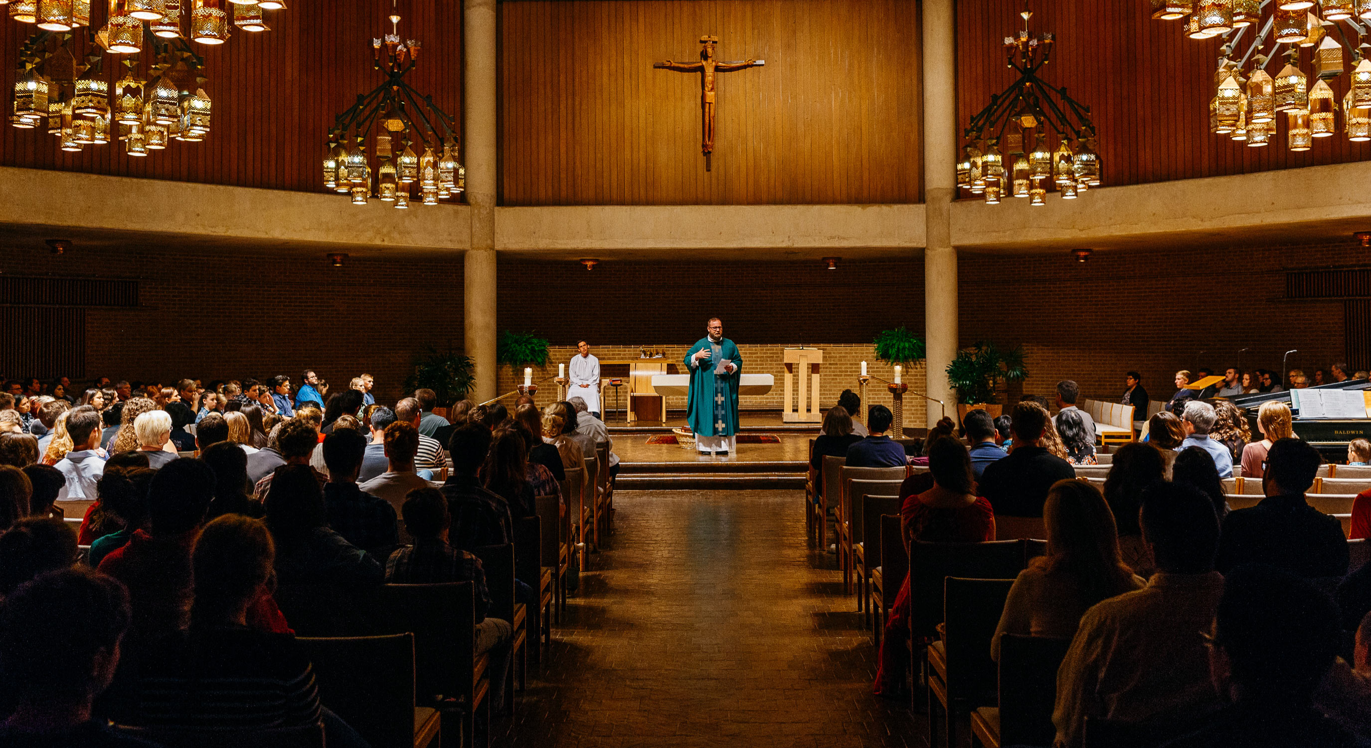 Professor Matthew Berry leads class on the steps of Cardinal Farrell Hall