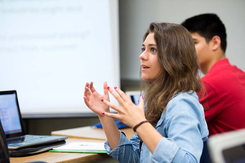 woman in class speaking and using hands