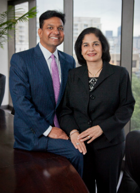 satish and yasmin gupta smiling at camera