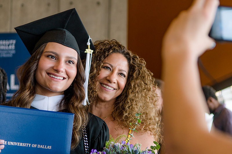 Graduate Posing with Parent